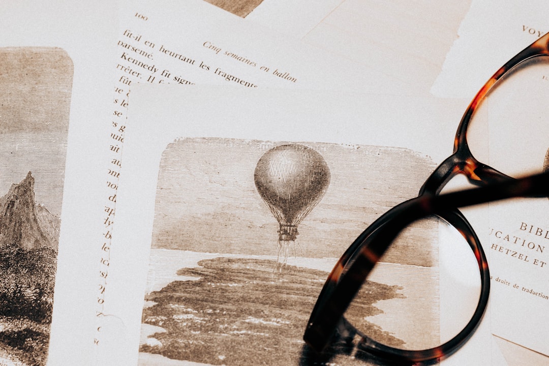 Photo by Mathias Reding black framed eyeglasses on white printer paper